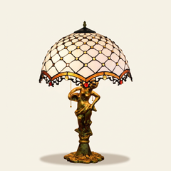 Cassiel 16 Inch Tiffany-style stained glass table lamp, Angelic Pole base, lit, on a plain ivory studio background