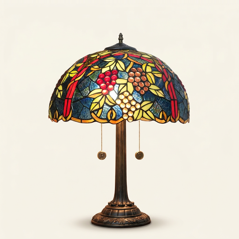 Vintara 17 Inch Tiffany-style stained glass table lamp, Straight Pole base, lit, on a plain ivory studio background