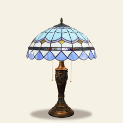 Marbella 16 Inch Tiffany-style stained glass table lamp, Rose Pole base, lit, on a plain ivory studio background