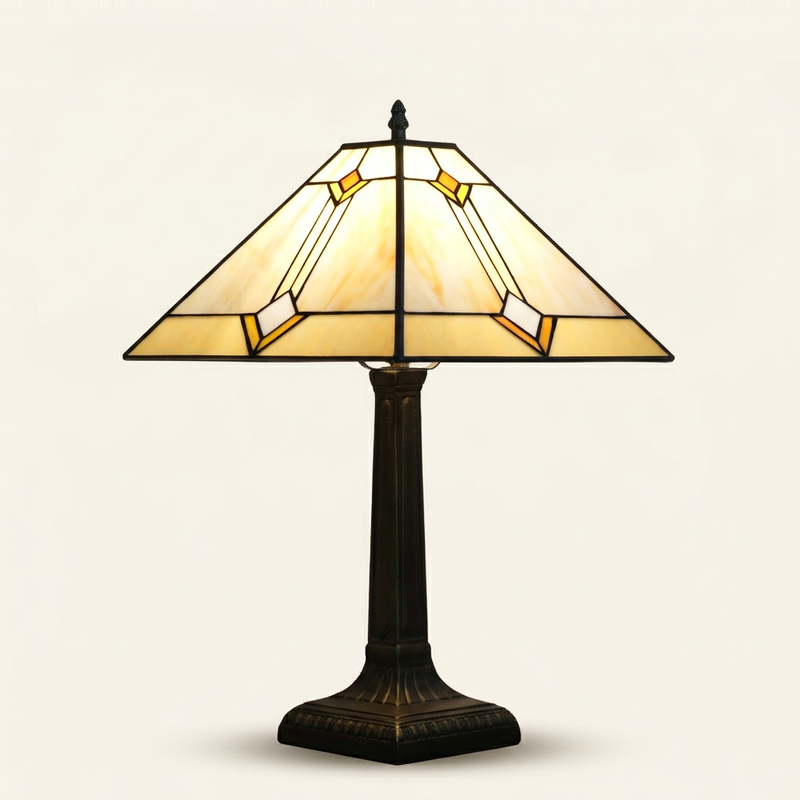 Ashford 16 Inch Tiffany-style stained glass table lamp, lit, on a plain ivory studio background