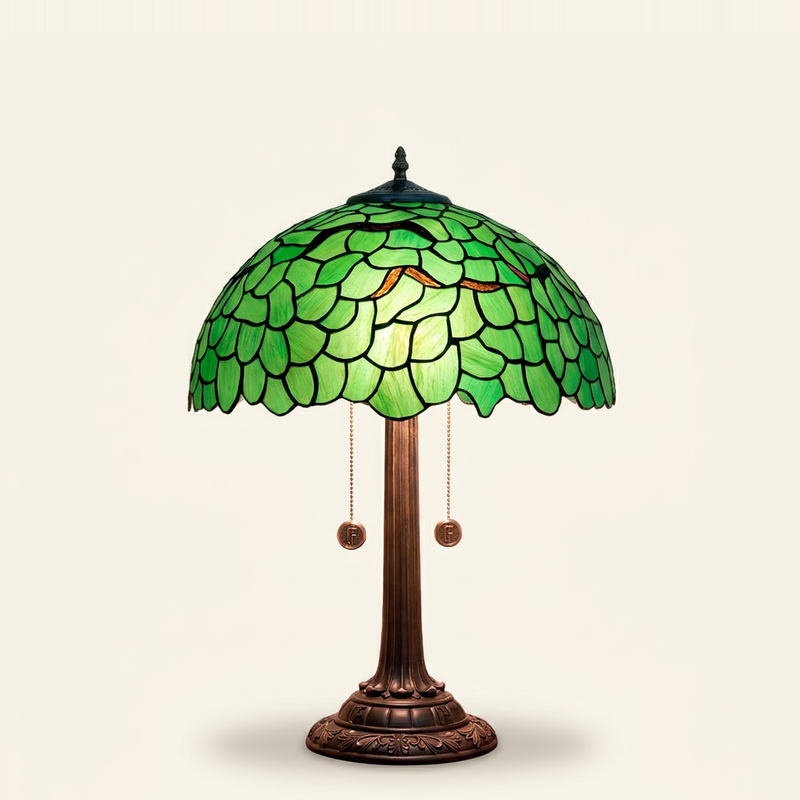 Verdelle 16 Inch Tiffany-style stained glass table lamp, lit, on a plain ivory studio background