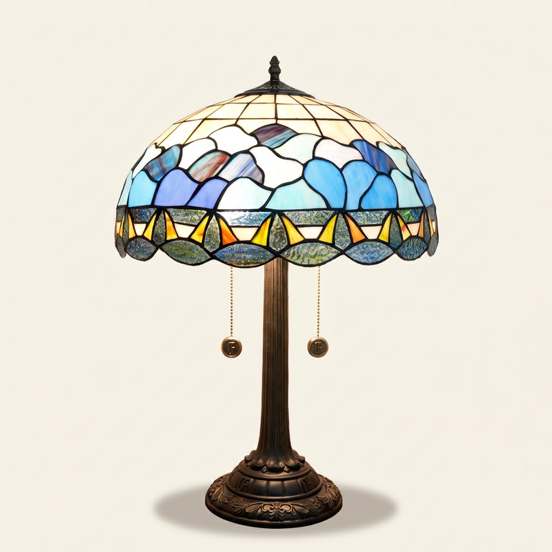 Oceane 16 Inch Tiffany-style stained glass table lamp, lit, on a plain ivory studio background